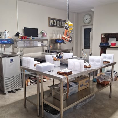 The practical chocolate room with work tables ready for a small group